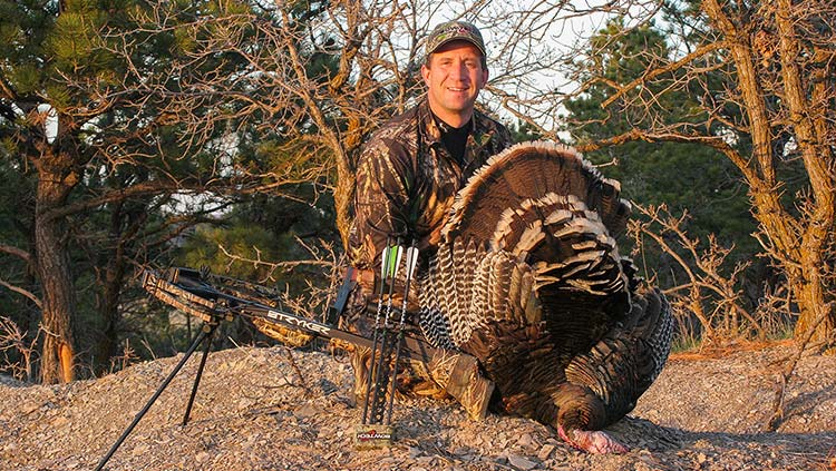 the author with his first gobbler taken while turkey hunting with a crossbow