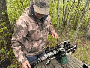 Tester reviewing the Ravin R500, the best crossbow for 2025.